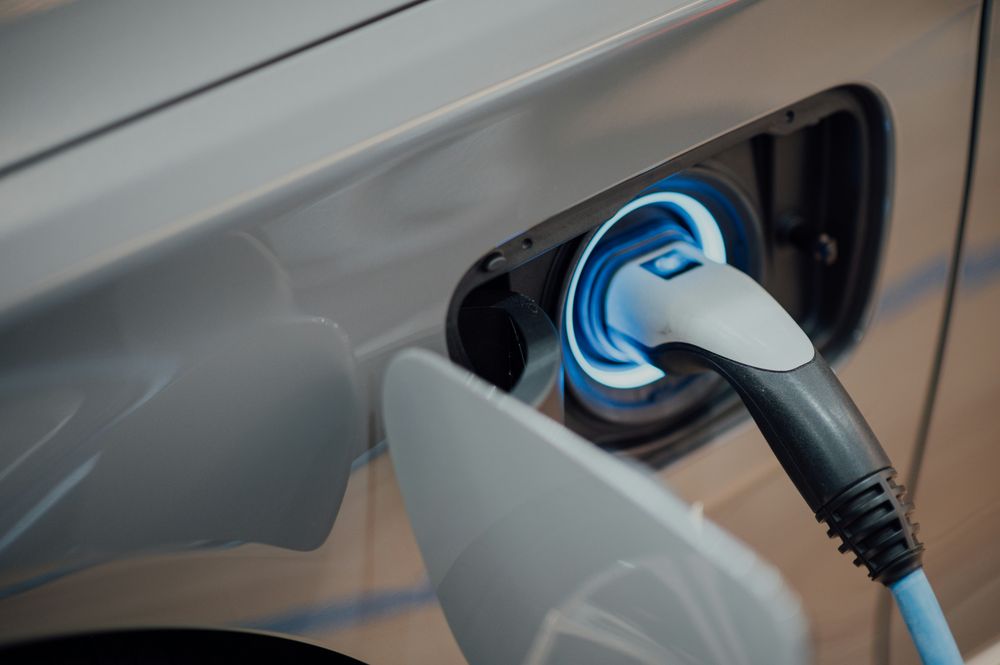 Sample image: an electric car plugged in to charge