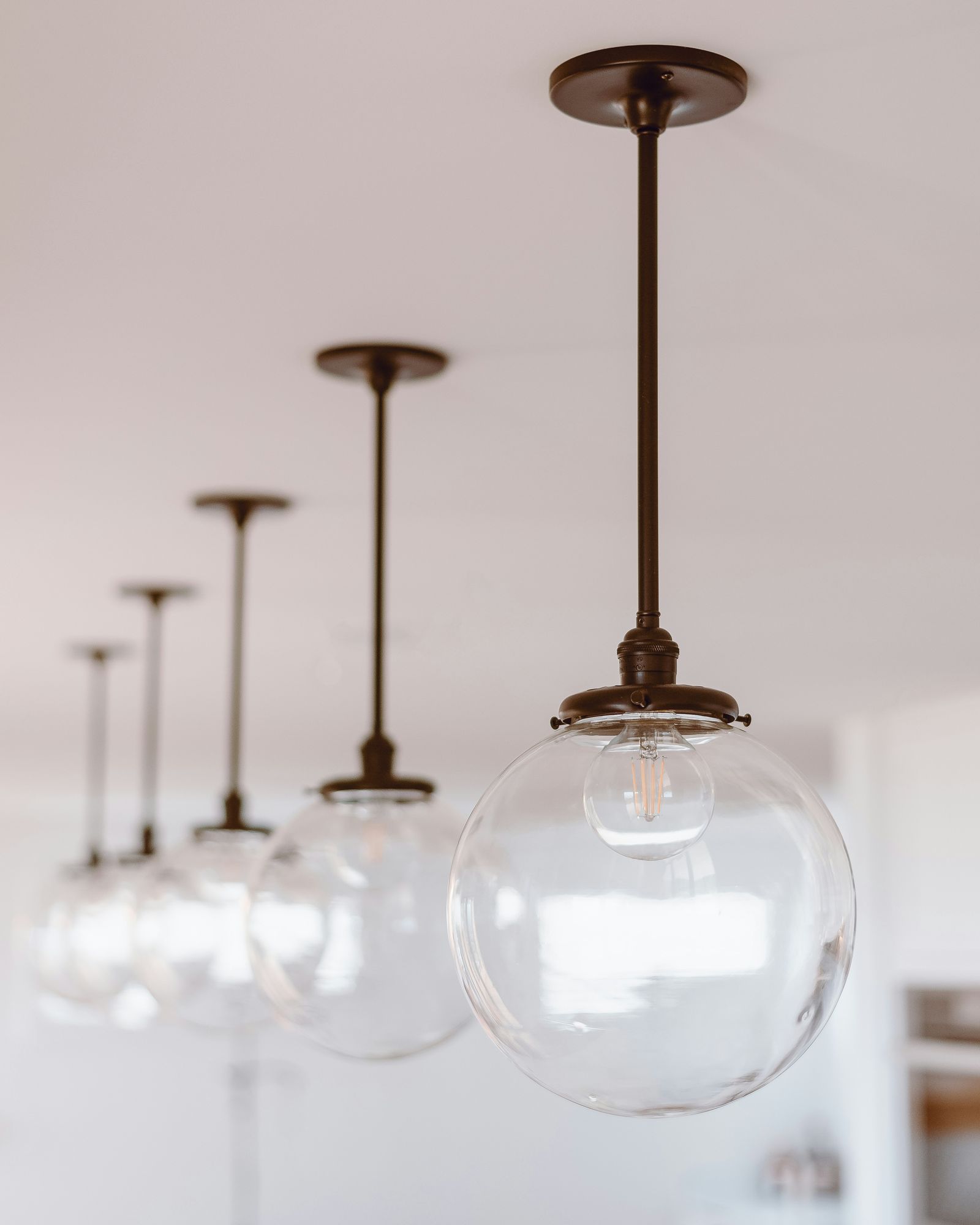 Sample image: a row of glass globe pendant lights